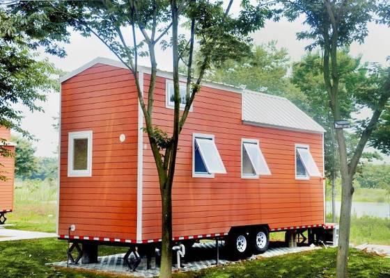 Mini Lightweight Prefabricated Tiny House Hotel Unit Orange Black Mobile House on Wheels for Travel